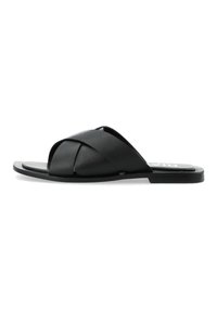 Sandali infradito in pelle nera con cinghie incrociate, suola piatta e soletta testurizzata. Design semplice con un'estetica minimalista.