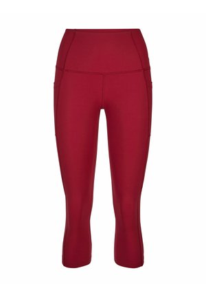 Leggings courts taille haute en rouge foncé uni avec coutures apparentes et poches latérales, conçus pour une tenue sportive.