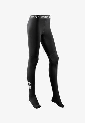 Black compression tights with a logo on the waistband and lower leg. The fabric appears smooth with a close-fitting design and structured knee areas.