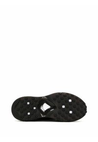 Semelle extérieure de chaussure de sport noire avec du caoutchouc texturé pour une meilleure adhérence, une section transparente dans la semelle intermédiaire, et de petits motifs circulaires pour une traction optimale.