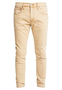 Light beige denim jeans with a slim fit, featuring five pockets, a zip fly, and contrasting stitching. Smooth texture with no visible patterns.