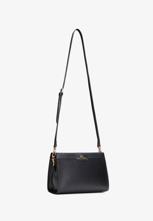Zwarte lederen schoudertas met verstelbare band, gouden hardware en "WITTCHEN"-logo op de voorflap.