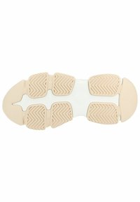 Semelle de chaussure en caoutchouc beige, dotée de motifs de traction en zigzag, d'un bout arrondi et d'une semelle intermédiaire blanche pour le soutien.