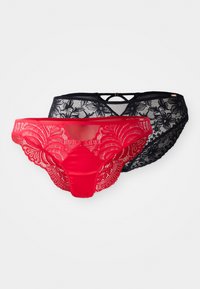 Red and black lace panties featuring floral patterns, sheer front, and a cross-back design. The red pair has decorative edges.