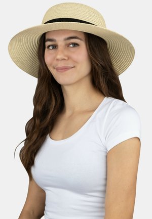 Wide-brimmed straw hat in natural beige with a black ribbon band, featuring a smooth texture and a classic, round shape.