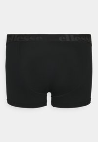 Svarta boxershorts i stretchigt material. Har en svart elastisk midja med ett upprepande logotyp. Slät textur med korta ben.