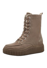 Bottines en daim marron avec un bout arrondi, un laçage à l'avant, une doublure en fausse fourrure et une semelle épaisse et crantée. Marquage sur le côté.