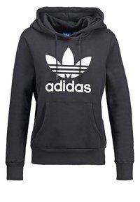 Svart huvtröja i bomullsblandning, med en vit Adidas-logotyp och tre ränder design på framsidan, samt en känguruficka.