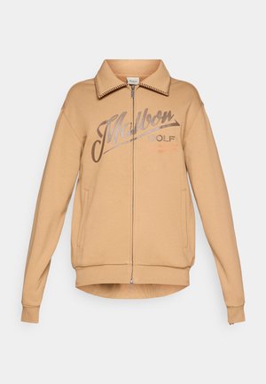 Ruda zip-up sportinė striukė su apykakle, ant kurios tamsiai ruda spalva užrašyta "Mallon GOLF". Apima šonines kišenes ir porinčius rankogalius bei apačią.