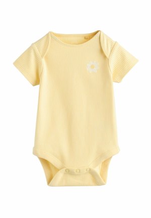 Kollane soonikkoes lühikeste varrukatega bodi, ümara kaelusega ja valge lille Tikandiga rinnal. Alumine osa kinnitatav klõpsudega.