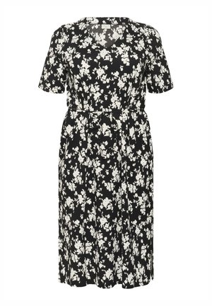 Zwarte bloemenjurk met korte mouwen, voorzien van een V-hals, een ceintuur in de taille en witte bloemmotieven overal. Lichtgewicht stof, kniehoogte.