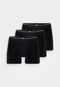 Schwarze Baumwoll-Boxershorts, Dreier-Pack. Mit elastischem Bund mit Logo, glatter Textur und figurbetonter Passform. Keine Muster oder Akzente.