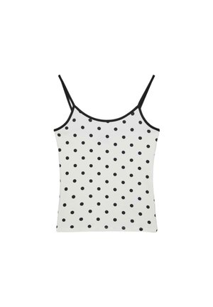 Wit mouwloos hemdtopje met dunne zwarte bandjes en een all-over zwart polkadotpatroon.
