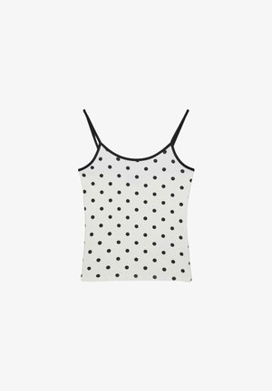 Wit mouwloos hemdtopje met dunne zwarte bandjes en een all-over zwart polkadotpatroon.