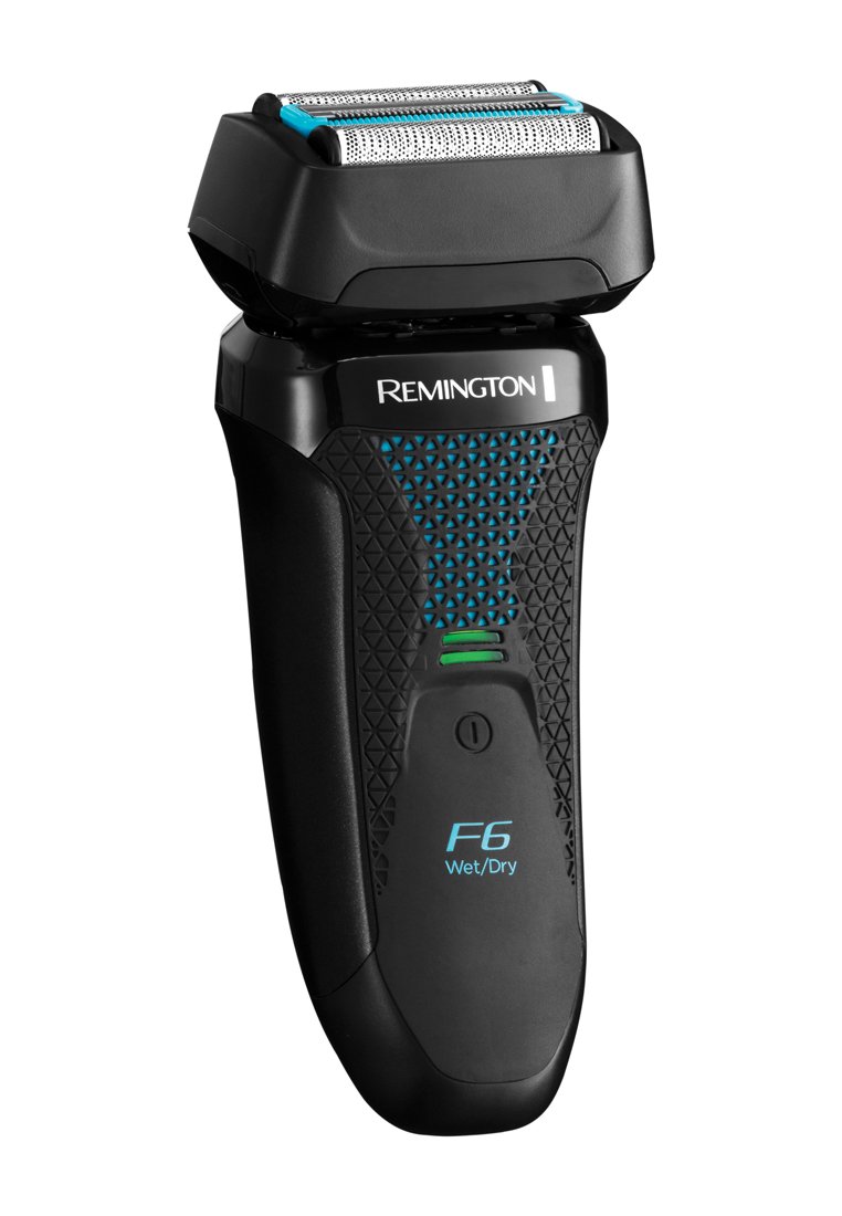 Maquinilla de afeitar eléctrica negra con empuñadura texturizada, que presenta una cabeza de lámina plateada y detalles en color azul verdoso. Incluye un botón de encendido y una etiqueta "F6 Húmedo/Seco".