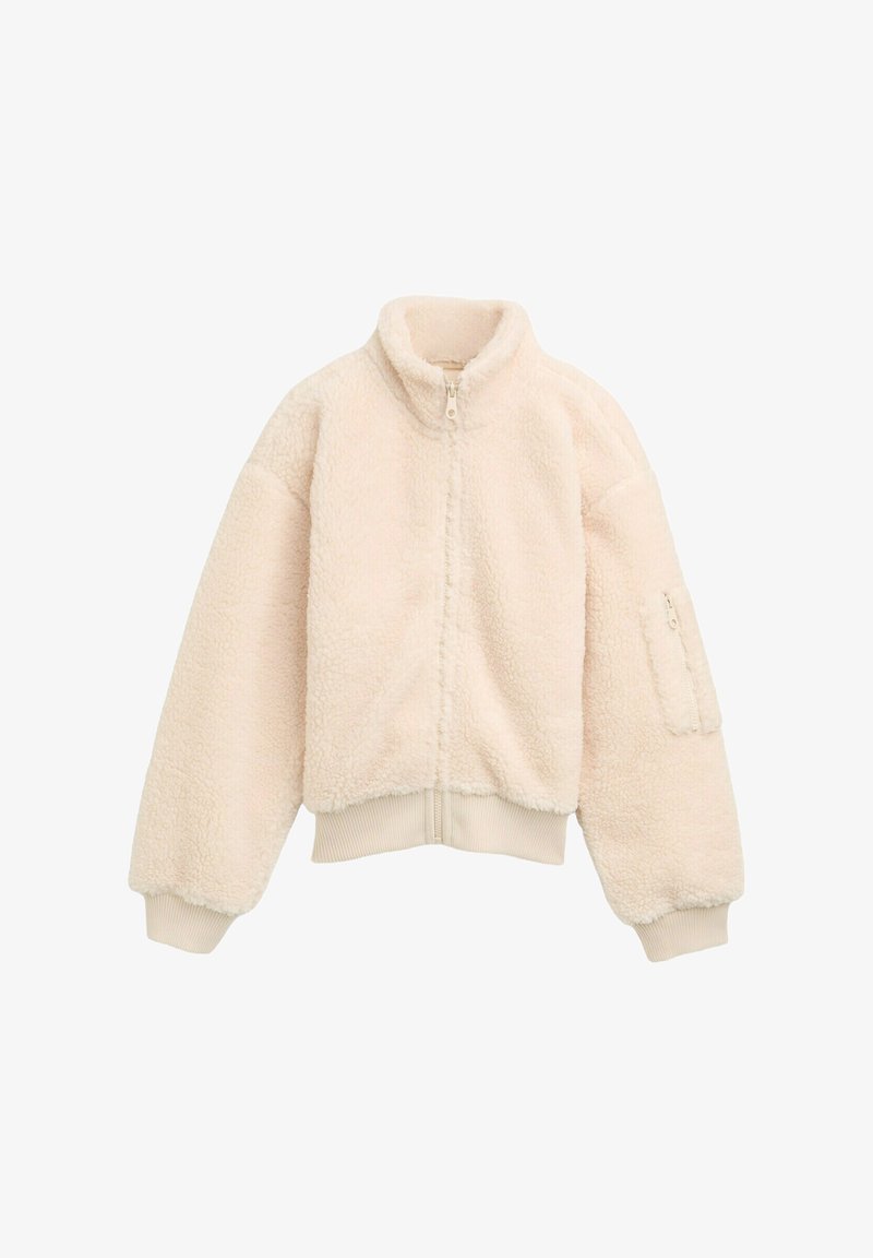 Veste zippée en polaire de couleur crème douce, avec un col haut, des poignets côtelés et une poche zippée sur le bras gauche. Ajustement confortable et ample.