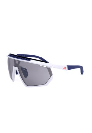Occhiali da sole sportivi con grandi lenti scure, montatura bianca, aste blu navy e piccolo logo Adidas rosso sul lato.
