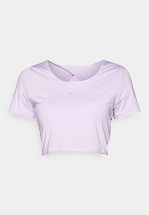 Hele lilla, lühikeste varrukatega, lühikese lõikega spordipaita, millel on ümmargune kaelus ja peen Nike logo hallis värvitoonis. Sile, veniv kanga materjal.