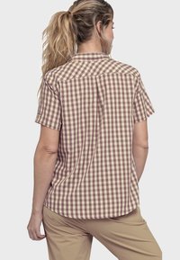 Kurzärmliges, karriertes Hemd in Beige und Braun, mit Kragen, Rückenpasse und abgerundetem Saum. Der Stoff wirkt leicht und atmungsaktiv.