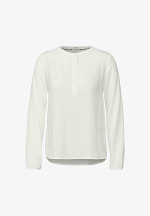 Biała koszula z długim rękawem z zaokrąglonym dekoltem, listwą z guzikami i teksturowanym materiałem. Krzywa dolna krawędź i luźny krój.