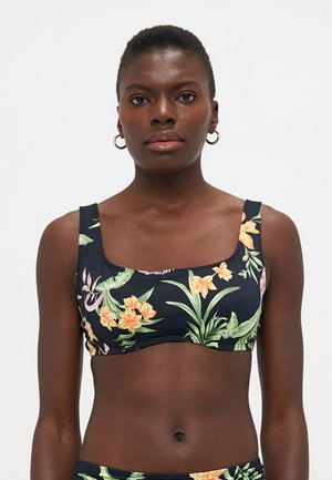 Blomstermønstret bikini topp i mørk marineblå med firkantet utringning og brede stropper. Har lyse oransje og grønne tropiske mønstre. Glatt tekstur.