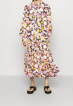 Langes, marineblaues Blumenkleid mit lebendigen rosa, gelben und weißen Blumen. Verfügt über einen kragenförmigen Ausschnitt, lange Ärmel und einen gestuften Rock.