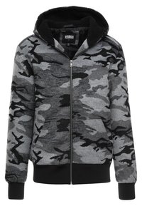 Sudadera con capucha de camuflaje gris, con forro de felpa negra, puños elásticos y bolsillos laterales. Material suave con una textura aterciopelada.