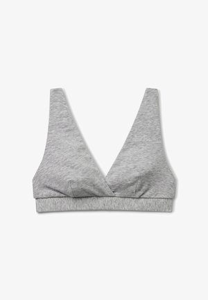 Soft gray seamless bralette with wide shoulder straps and a deep V-neckline, laid flat on a white background.