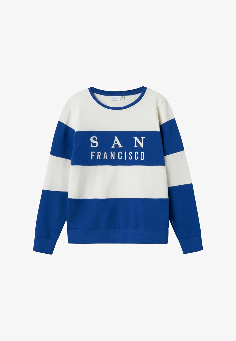 Sinine ja valge triibuline särk "SAN FRANCISCO" tekstiga. Omab ümarat kaelust ja soonikutega varrukaotsa. Valmistatud pehmest puuvilla ja sünteetika segu kangast.