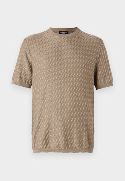 Beige knitted t-shirt with a textured diamond pattern, short sleeves, and a round neckline. Soft fabric and even stitching details.