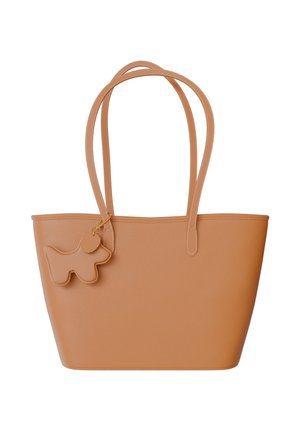 Tan leather tote bag with two shoulder straps and a dog-shaped charm attached. The bag features a textured surface and simple design.