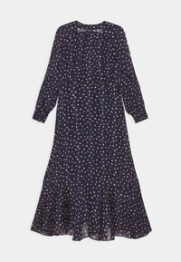 Sininen mekko, jossa on pitkät hihat, vaaleanpunaisia pilkkuja, poimutettu helma ja istuva vyötärödesign. Valmistettu kevyestä kankaasta.