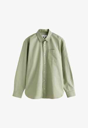 Lys grøn, langærmet skjorte med knapper. Har en spids krave, en enkelt brystlomme og en afslappet pasform. Lavet af glat stof.