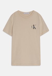 Beżowa bawełniana koszulka z okrągłym dekoltem, krótkim rękawem i nadrukowanym logo na piersi dla prostego, nowoczesnego designu.