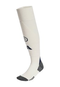 Biele podkolienky s čiernymi akcentmi na päte, špičke a podrážke, s čiernymi logami a rebrovanou textúrou v hornej časti lýtka.