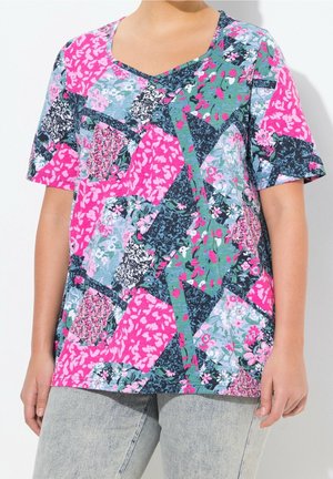 Short-sleeve patchwork t-shirt featuring a V-neck, predominantly pink, blue, and green floral patterns with varying shapes and textures.