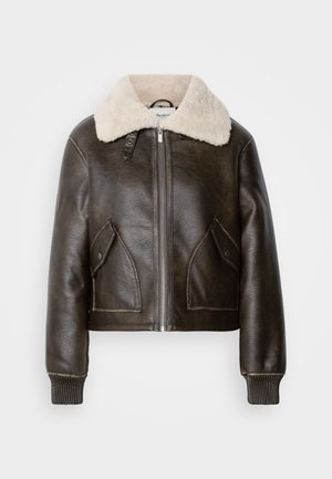 Rjava usnjena bombarderska jakna z belim krznom na ovratniku, z dvostranskim zadrgo, dvema sprednjima žepoma in rebrastimi manšetami. Skrčena zasnova.