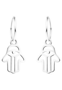 Silverfärgade hoops i öronen som har en handmotiv med en ögon design i centrum. Slät yta med en öppnad struktur.