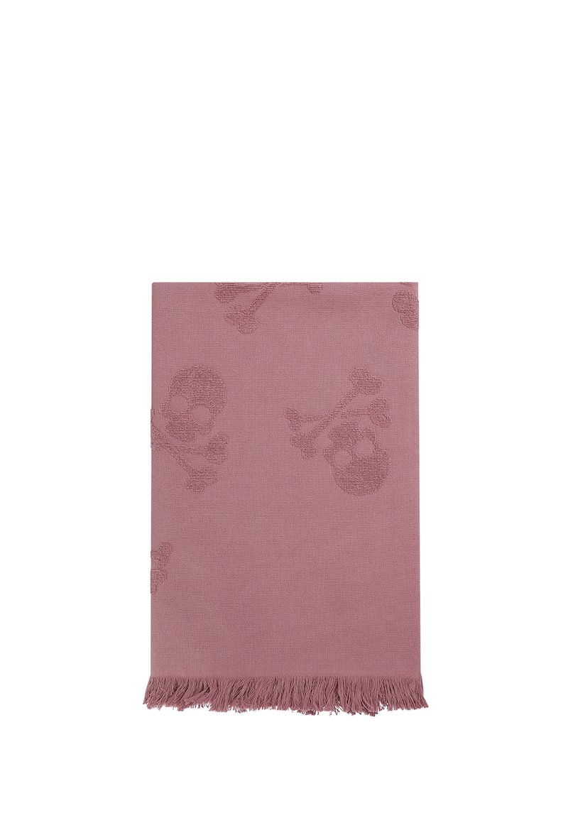 Couverture tissée rose avec un motif texturé de skulls et de tibias, dotée de bords à franges. Le tissu doux offre une apparence chaleureuse.