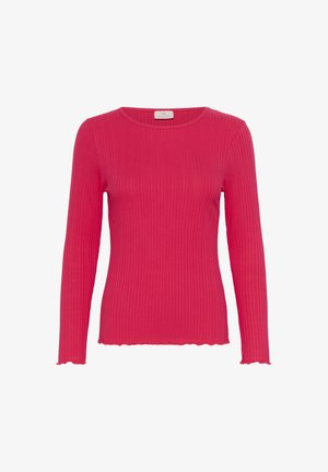 Fokusas ilga rankovėmis viršus ryškiai rožinės spalvos velveto medžiagoje. Turėti apvalų iškirpimą ir bangomis suformuotus kraštus ant rankovių ir hem.