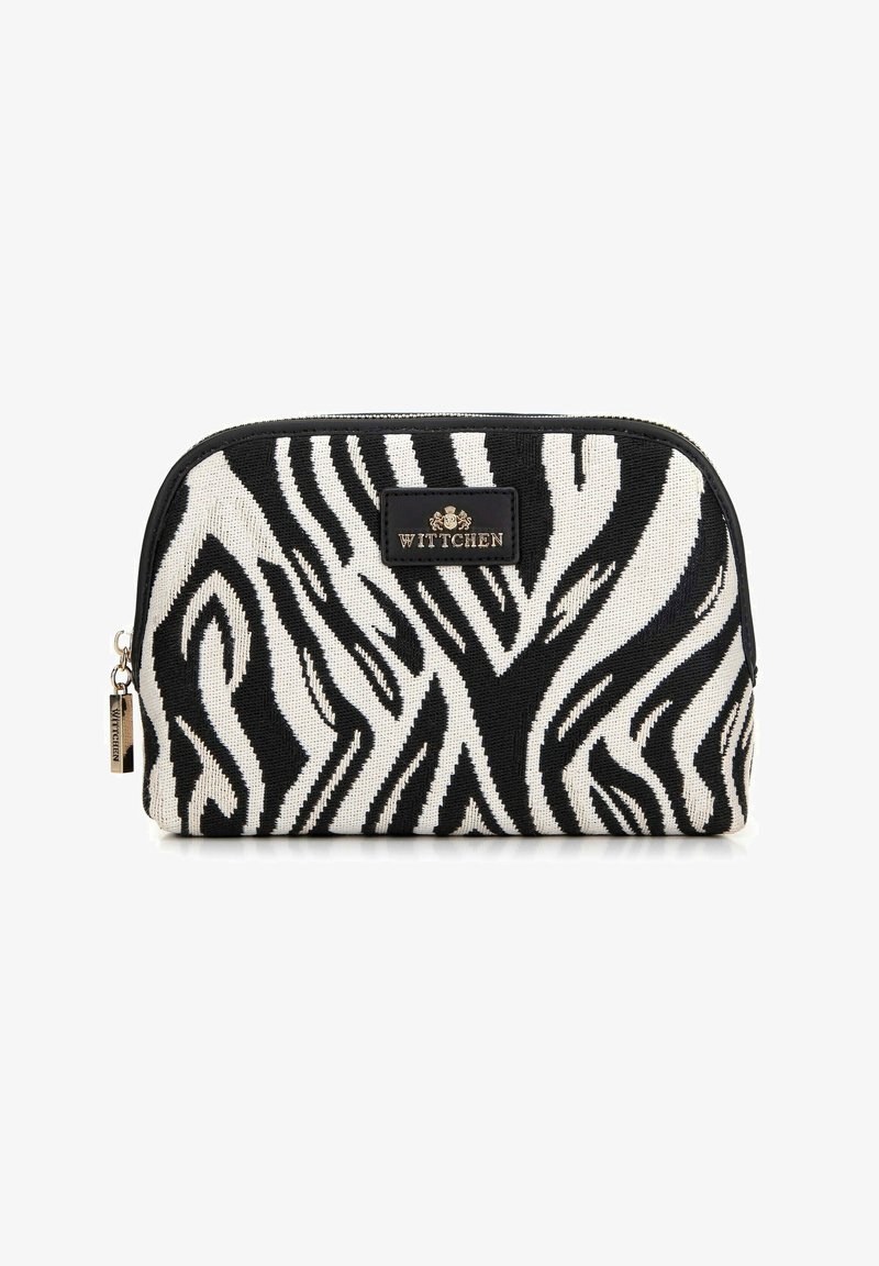Trousse de maquillage rayée noir et blanc avec une fermeture éclair et une étiquette de marque "WITTCHEN" à l'avant.