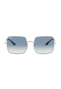 Occhiali da sole Ray-Ban con una montatura quadrata in metallo, lenti blu sfumate e aste in plastica nera. Il design è elegante con dettagli chiari.