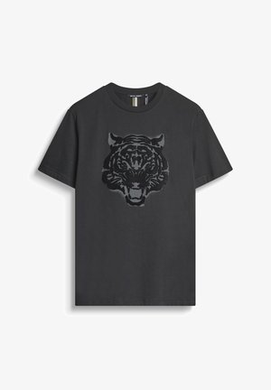T-shirt en coton noir avec un graphique d'une tête de tigre texturée dans une teinte plus sombre. Col rond classique et manches courtes.