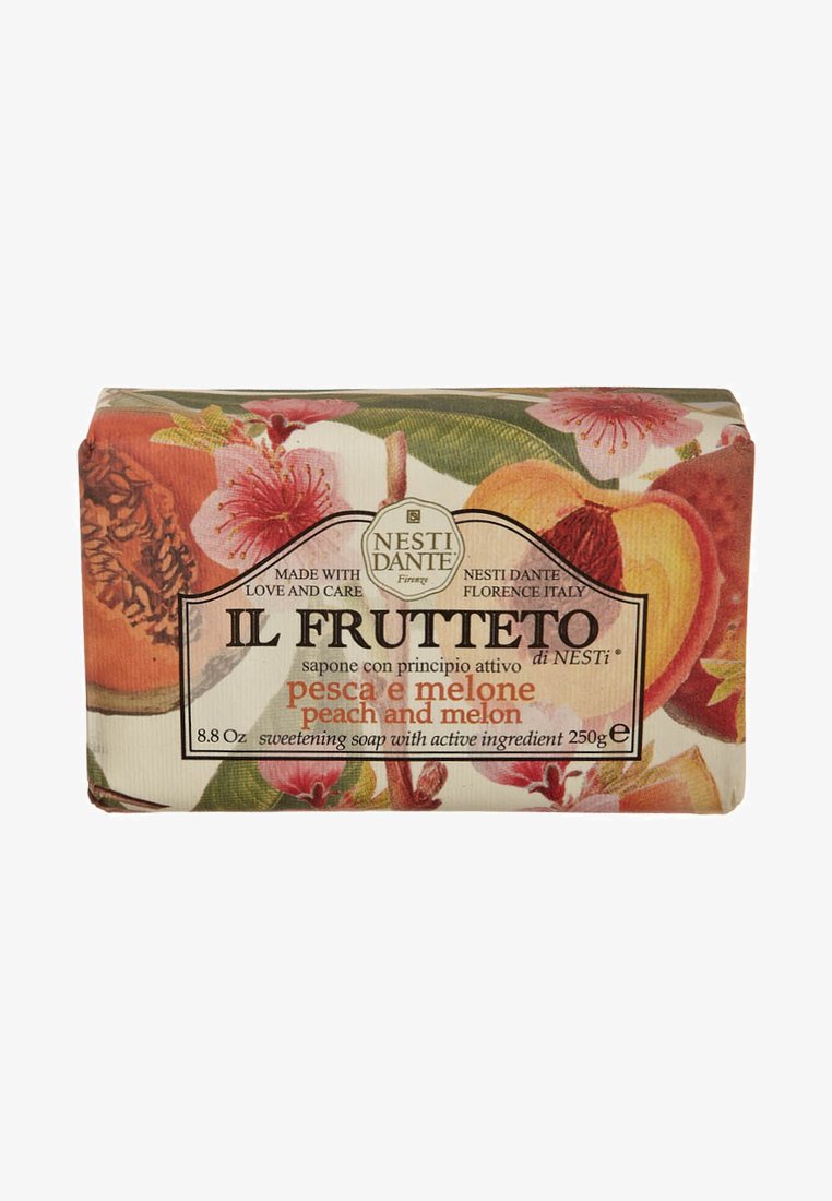 Sweetening soap bar with floral packaging featuring peach and melon illustrations. Rectangular shape, predominantly pastel colors, and detailed text.
