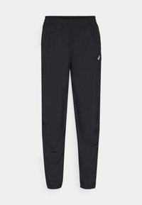 Svarta träningsbyxor med elastiskt midjeband, smalnande ben och en liten vit logotyp på högra sidan. Slät tygtextur genom hela byxorna.