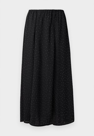 Gonna nera realizzata in tessuto leggero con una vita arricciata. Presenta un motivo di piccoli punti bianchi su tutto il tessuto.