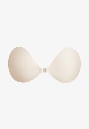 Nude strapless-bra, jossa on muotoillut kupit ja keskellä muoviklipsi. Tasainen kangas ja saumatonta muotoilua huomaamatonta käyttöä varten.