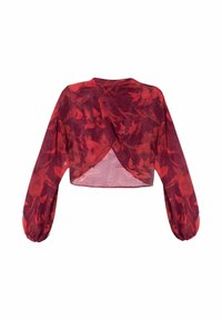 Blouse rouge courte avec de longues manches bouffantes et un design croisé. Elle présente un motif floral et une texture translucide.