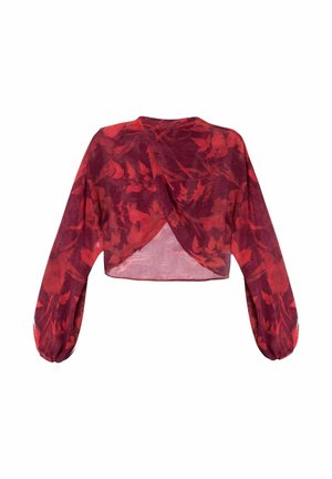 Blusa roja corta con mangas largas y abullonadas y diseño envolvente. Presenta un patrón floral y una textura translúcida.