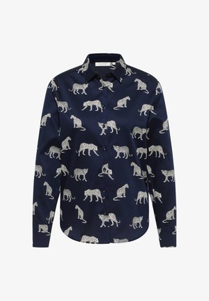 Chemise marine avec un imprimé léopard répété en blanc. Fabriquée en tissu lisse, elle possède un col à boutons et des manches longues.